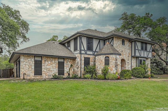 tudor house with a front yard