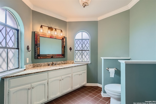 bathroom with ornamental molding, toilet, tile patterned flooring, and vanity