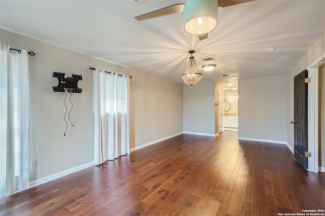 spare room featuring dark hardwood / wood-style floors and ceiling fan