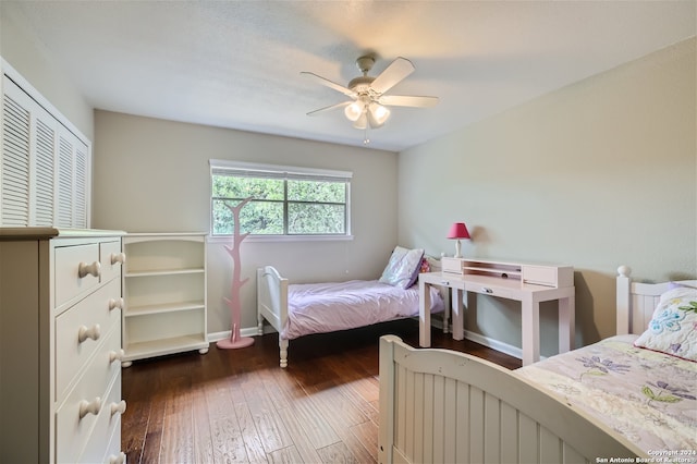 bedroom featuring dark wood-type flooring and ceiling fan