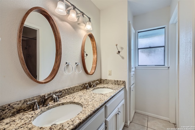 bathroom with tile patterned flooring and vanity