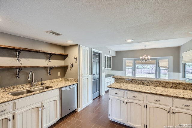 kitchen with white cabinetry, sink, decorative light fixtures, and dishwasher