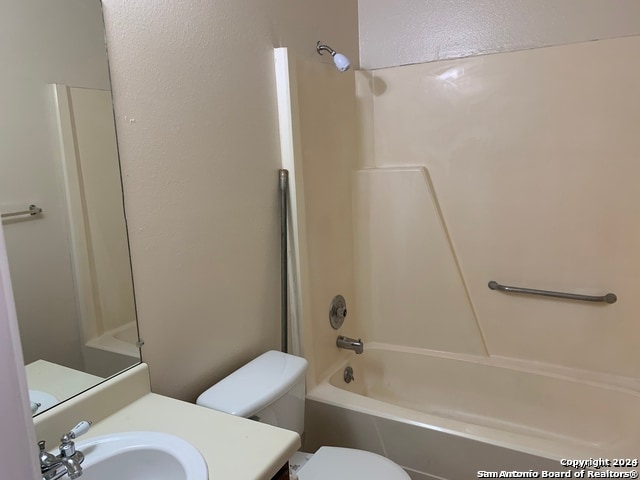 full bathroom featuring vanity, toilet, and washtub / shower combination