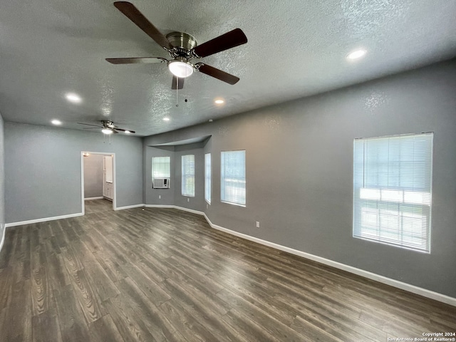 spare room featuring a textured ceiling, ceiling fan, and hardwood / wood-style floors