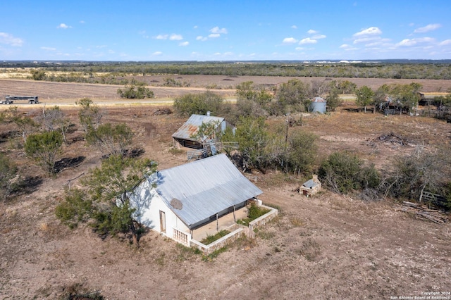 birds eye view of property with a rural view