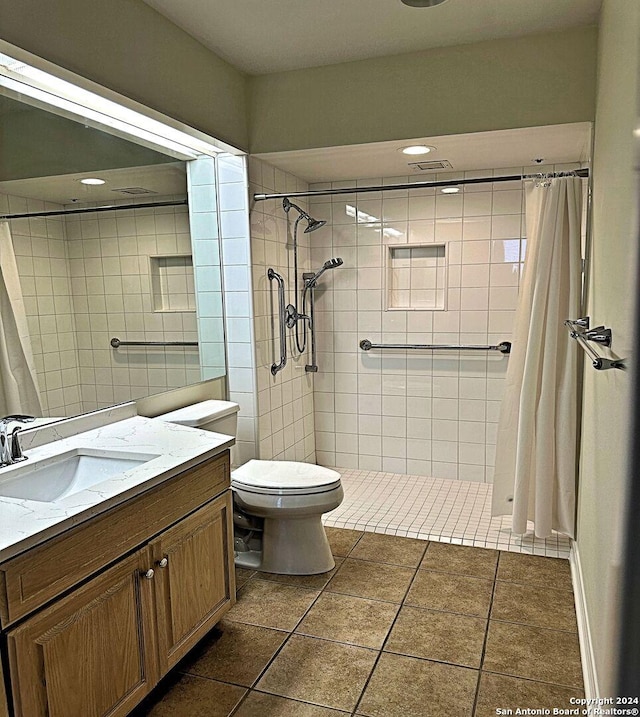 bathroom with toilet, vanity, and curtained shower