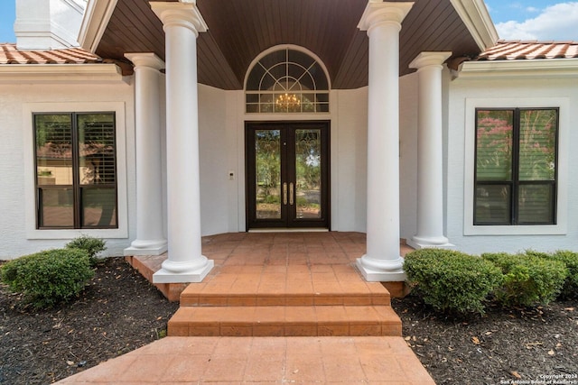 entrance to property featuring french doors