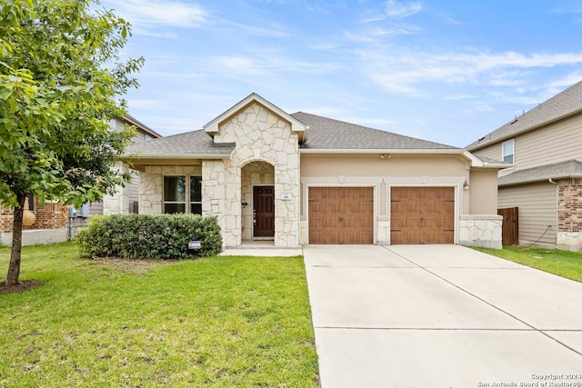 view of front of home featuring a garage and a front yard