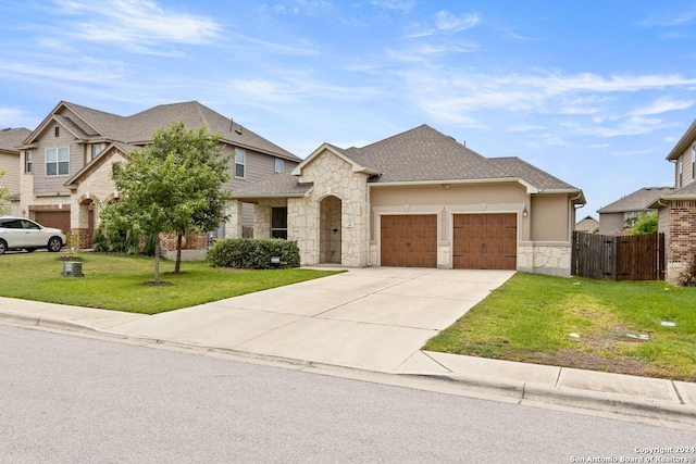 view of front of property featuring a garage and a front yard