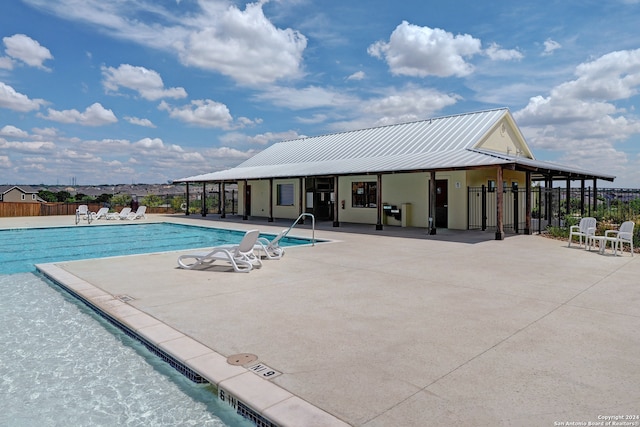 view of swimming pool with a patio area