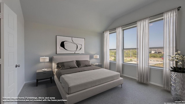 bedroom with lofted ceiling, multiple windows, and carpet flooring