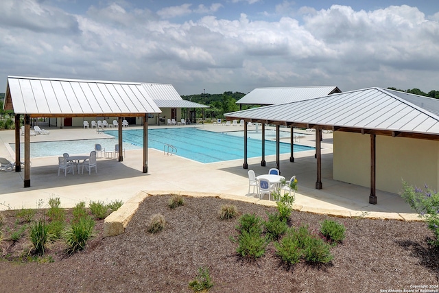 view of swimming pool featuring a patio area