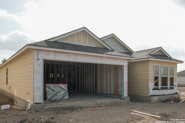 unfinished property with a garage