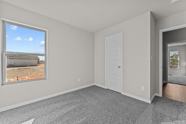 unfurnished bedroom featuring carpet flooring