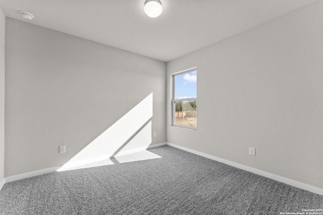 unfurnished room with carpet floors