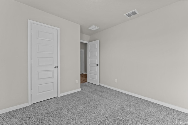 unfurnished bedroom featuring carpet