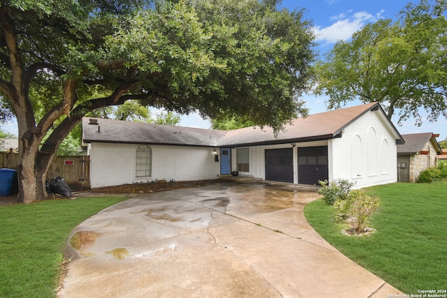 ranch-style house with a front lawn