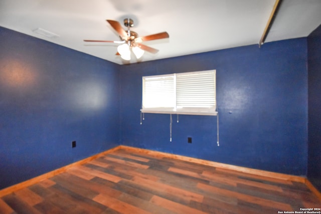 empty room featuring hardwood / wood-style floors and ceiling fan