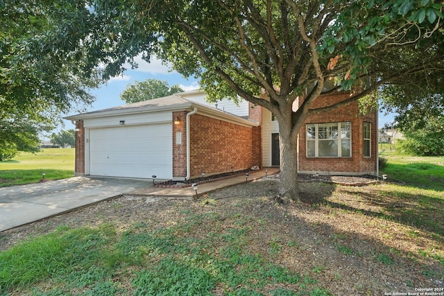 view of front of house with a garage and a front yard