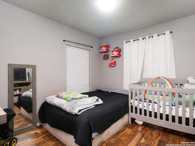 bedroom featuring dark wood-type flooring