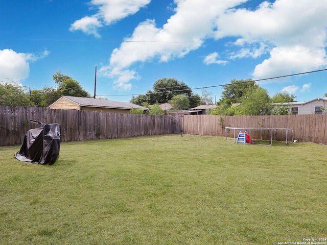 view of yard with a trampoline