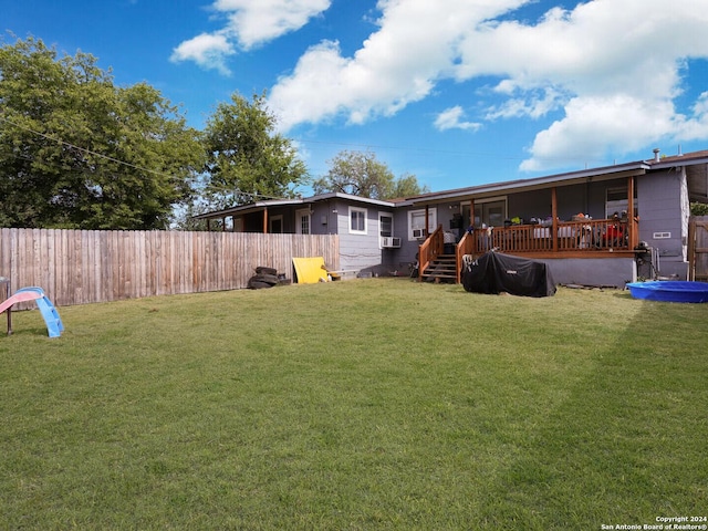 view of yard with a wooden deck