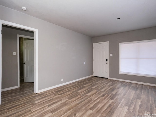 spare room featuring dark hardwood / wood-style flooring