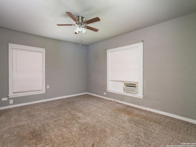 empty room with ceiling fan, cooling unit, and carpet