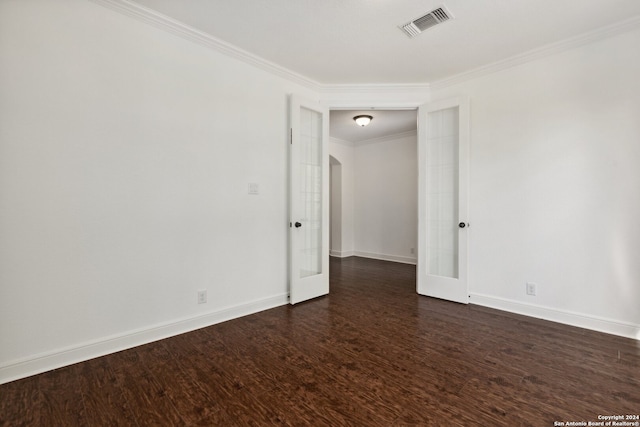 unfurnished room with ornamental molding, french doors, and dark hardwood / wood-style flooring