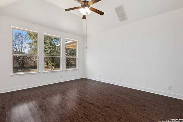 spare room with lofted ceiling, dark hardwood / wood-style floors, and ceiling fan