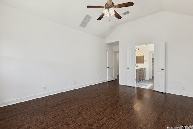 unfurnished bedroom featuring high vaulted ceiling, ensuite bath, hardwood / wood-style flooring, and ceiling fan