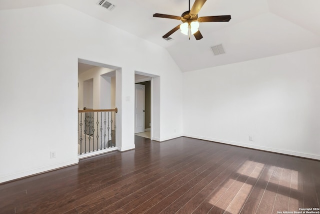 empty room featuring lofted ceiling, ceiling fan, and dark hardwood / wood-style floors