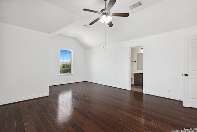 empty room with ceiling fan, vaulted ceiling, and dark hardwood / wood-style flooring