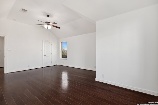 unfurnished room with vaulted ceiling, dark hardwood / wood-style flooring, and ceiling fan