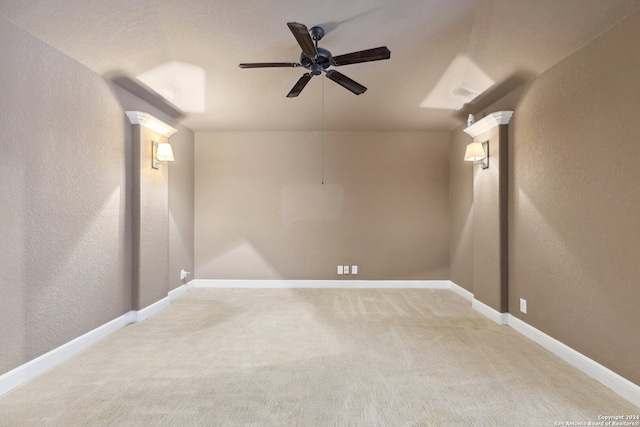 carpeted empty room featuring ceiling fan