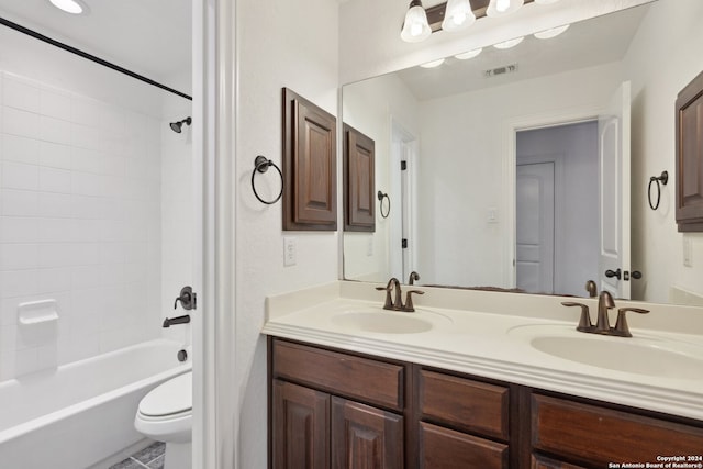 full bathroom with  shower combination, vanity, and toilet