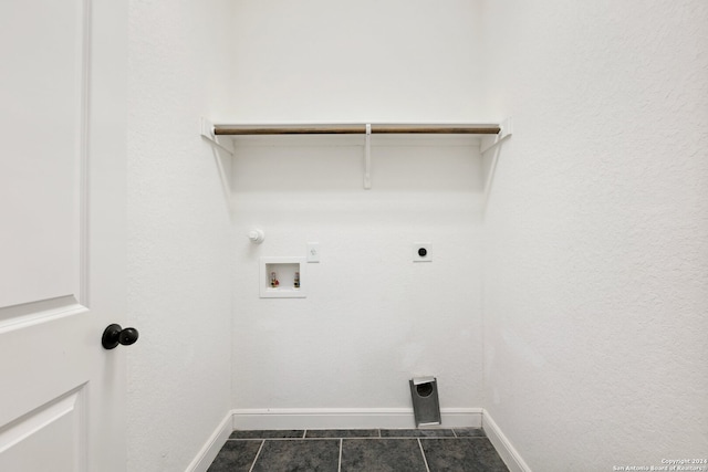 washroom with washer hookup, gas dryer hookup, dark tile patterned flooring, and hookup for an electric dryer