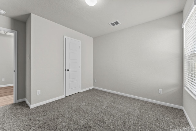 unfurnished bedroom featuring carpet