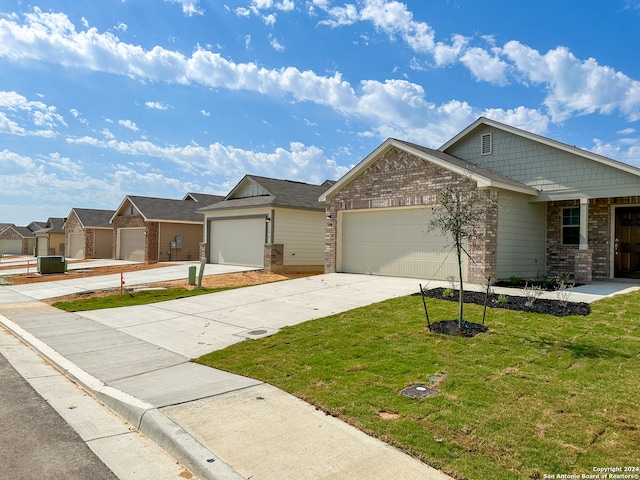 view of front facade with a garage and a front lawn