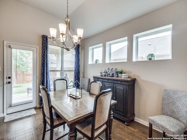 kitchen with ceiling fan with notable chandelier, vaulted ceiling, sink, a center island with sink, and stainless steel fridge with ice dispenser