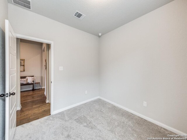 living area with wood-type flooring and vaulted ceiling