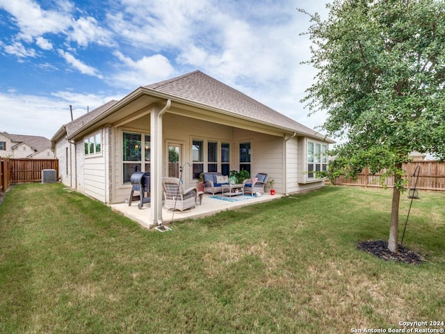 rear view of property with cooling unit, an outdoor hangout area, a patio, and a yard