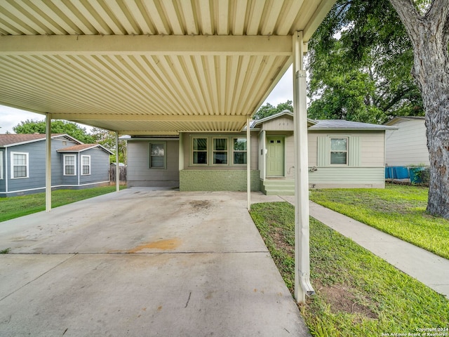 view of patio / terrace featuring a carport