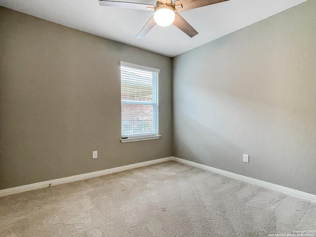 unfurnished room featuring carpet floors and ceiling fan