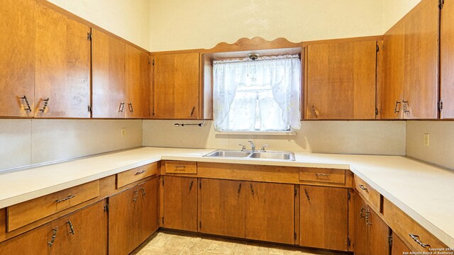 kitchen with sink and light tile patterned floors