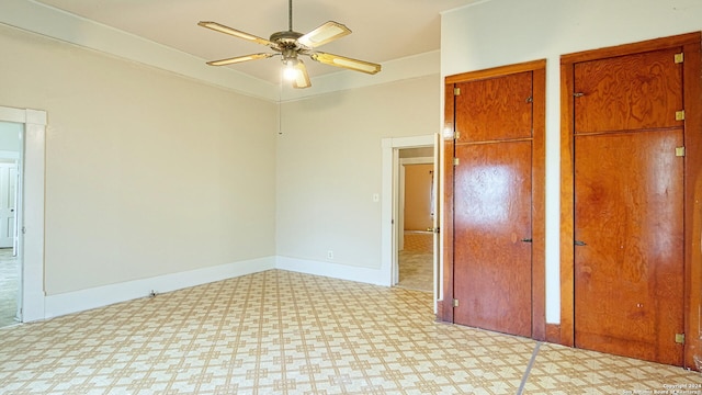 unfurnished bedroom featuring light tile patterned flooring and ceiling fan