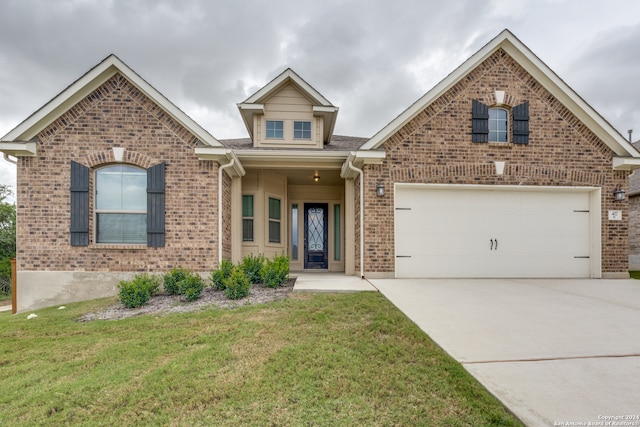 front of property with a garage and a front lawn