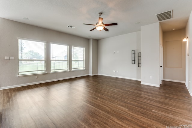 spare room featuring dark hardwood / wood-style floors and ceiling fan