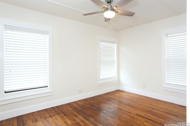 spare room featuring plenty of natural light, ceiling fan, and hardwood / wood-style flooring