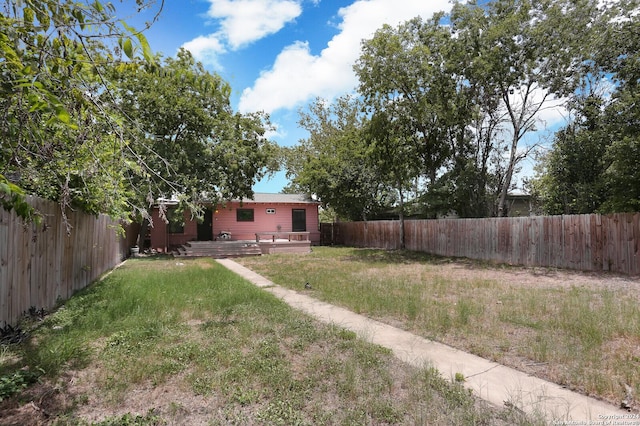 view of yard featuring a wooden deck